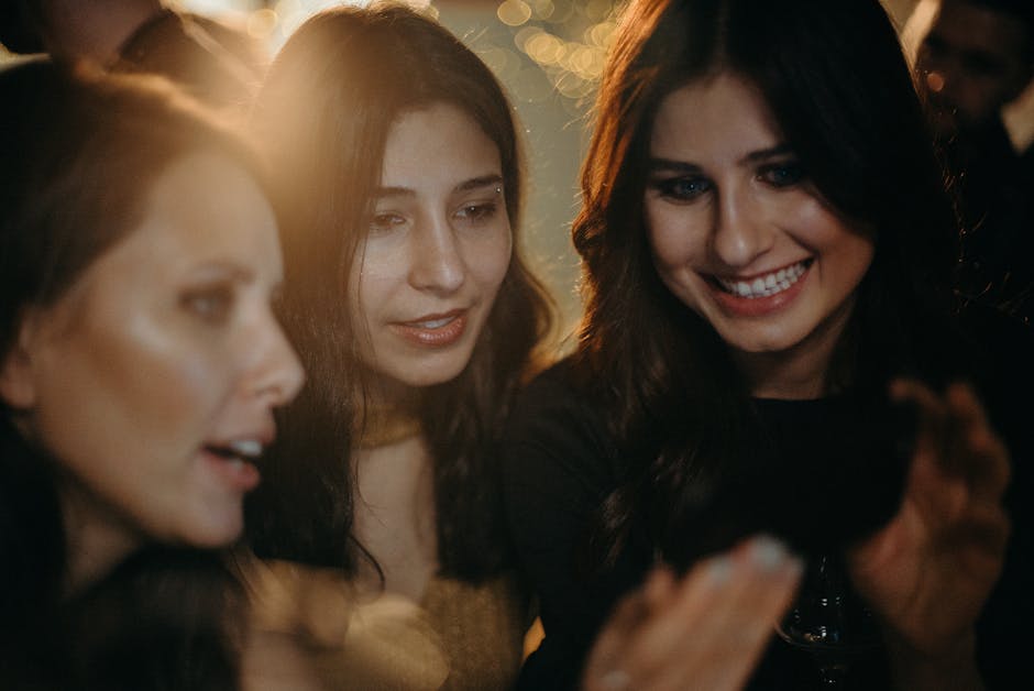 A diverse group of people looking relaxed and happy in a bright, modern setting.